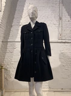 Sweet vintage black wool mix coat by Miu Miu ( Miuccia Prada) black wool epaulets font pockets and side pockets top of coat is styled like army coat/jacket with pleated skirt attached to it front button closure fully lined great vintage condition ( amazing quality) 80% wool 20% nylon size 42 please refer to measurements armpit to armpit 45 cm shoulder to shoulder 40 cm sleeve 50 cm waist 40 cm hip free length 87 cm If you have any other questions please send me a message and see my other listing Fitted Black Wool Coat With Pockets, Fall Workwear Outerwear With Epaulettes, Winter Workwear Outerwear With Epaulettes, Winter Pleated Workwear Outerwear, Winter Uniform Style Single Breasted Outerwear, Winter Uniform Style Single-breasted Outerwear, Single Breasted Uniform Style Winter Outerwear, Pleated Long Sleeve Winter Outerwear, Black Military Outerwear With Epaulettes