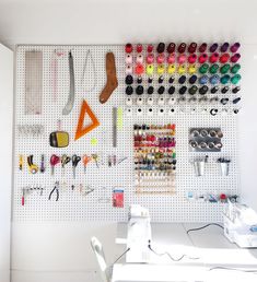 the sewing room is organized with lots of crafting supplies