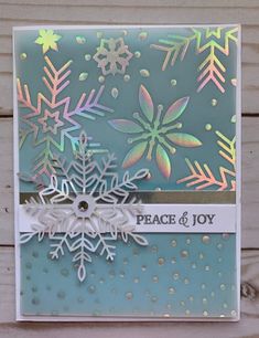 a card with snowflakes on it that says peace and joy