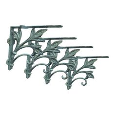 three metal brackets with leaves and vines on each one, set against a white background