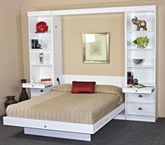 a bedroom with a bed, bookshelf and shelves in the wall next to it