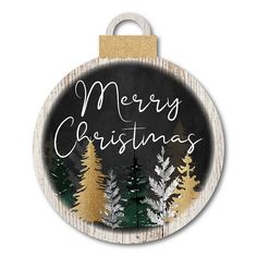 a merry christmas ornament hanging on a wooden plaque with pine trees in the background