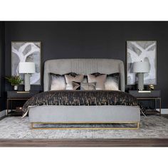 a bedroom with black walls and gold accents