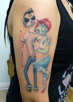 a woman with a cartoon tattoo on her arm