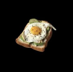 a piece of toast with an egg on it