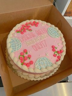 a pink birthday cake in a box with the words happy birthday to you on it