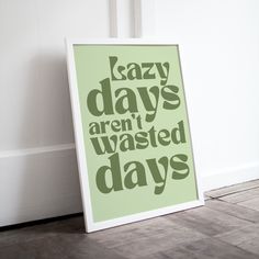 a green poster with the words lazy days aren't wasted days written on it