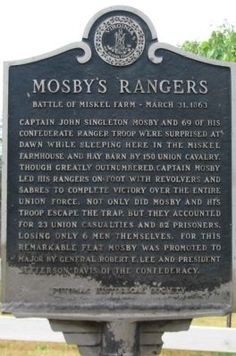 the mossy's ranchers marker is located in front of a fence and trees