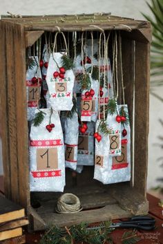 an old wooden box filled with christmas stockings and twine wrapped in burlocks