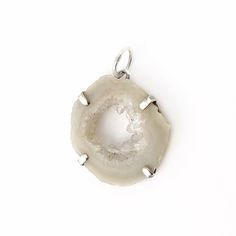 "This one of a kind pendant is made with a slice of natural occo agate with tiny Quartz crystal druzy. They are completely natural, agatized and covered in stunning quartz crystals in the center. This unusual gem is a soft beige color with clear crystals. The occo druzy is prong set in Sterling silver and measures 1\" inch. The entire pendant measures 1 1/4\" inches in length. The pendant bale is 1/4\" inch (6mm). If you would like this pendant as a necklace, you can purchase it with a necklace Large Agate Geode For Spiritual Purposes, Large Agate Geode For Spiritual Use, Handmade White Agate Geodes, Spiritual Agate Geodes With Natural Stones, White Natural Stones Geode For Healing, White Natural Stone Geodes For Spiritual Use, White Natural Stone Geodes For Healing, Silver Agate Geode With Natural Stones, Silver Agate Geodes