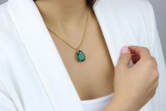 Exceptionally elegant and remarkably giftable, this Green Onyx pendant necklace will instantly tie up your favorite looks. Fashioned in 14k yellow gold, this long necklace boasts a faceted, teardrop Onyx held in claws. A gemstone necklace that will stay timeless and sophisticated.▂▂▂▂▂▂▂▂▂▂▂▂▂▂▂▂▂▂▂▂▂▂▂▂▂▂▂♥ Gemstone Type - Green Onyx ♥ Gemstone Size - 16x20mm♥ Gemstone Cut - Pear - More options available in the drop down menu♥ Metal Type (Main Photo) - 14k Gold Filled - More options available i Elegant Emerald Teardrop Pendant Necklace Gift, Elegant Drop Emerald Necklace For Gift, Elegant Teardrop Emerald Necklace Gift, Elegant Green Drop Necklace As A Gift, Elegant Green Drop Necklace For Gifting, Elegant Teardrop Emerald Necklace As A Gift, Elegant Green Drop Necklace For A Gift, Elegant Gold Teardrop Pendant Emerald Necklace, Gold Pear-shaped Emerald Necklace Gift