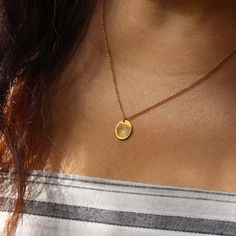 The Chiara necklace is a light gold round disc necklace that you just NEED. Whether you wear it alone or stacked, with your another necklace or bare alone- it's perfect. Add a personal touch to your Chiara necklace with an engraved fingerprint of a loved one. If you can dream it- we can make it happen. Chain Length: Length: 42cm/16" (extension: 3cm/1.8") Total 45cm/18" Element: Size: 10mm All features can be customized! Talk to us, we love making custom designs. Our jewelry is carefully handmade in our atelier Minimalist Engraved Circle Necklaces, Minimalist Engraved Circle Necklace, Minimalist Circle Engraved Necklace, Minimalist Engraved Round Pendant Charm Necklaces, Minimalist Engraved Round Pendant Charm Necklace, Dainty Engraved Round Pendant Coin Necklace, Minimalist Yellow Gold Circle Coin Necklace, Minimalist Engraved Oval Pendant Charm Necklace, Minimalist Engraved Yellow Gold Coin Necklace