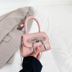 About this item 🌈 All-Season Charm: Designed to complement your little one's style in every season, this mini handbag adds a trendy accessory that effortlessly elevates any outfit. 👧 Versatile Fashion: With a fashion-forward design, this crossbody coin purse is a versatile accessory that enhances the style of both casual and dressy ensembles, making it perfect for any occasion. 👜 Quality Material: Crafted from high-quality PU material, this mini handbag not only looks chic but also promises d Handbag Luxury, Bow Style, Diamond Bows, Lipstick Bag, Chest Bag Men, Lady Style, Girls Handbags, Mini Handbag, Rhinestone Bow