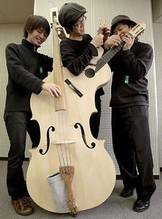 two young men are playing instruments together in an office setting with the caption that says,