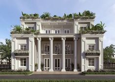 a large white building with many windows and plants on the balconies