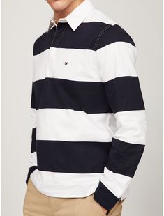 Tommy Hilfiger men's polo. Everything you love about our preppy rugby stripe polos in soft, cotton jersey and finished with a hidden button placket.  Material: 100% Cotton. Preppy White Polo Shirt With Striped Collar, White Cotton Polo Shirt With Horizontal Stripes, Preppy Striped Polo Shirt, White Polo Collar Top With Horizontal Stripes, Striped Preppy Polo Shirt, White Polo Shirt With Horizontal Stripes, White Striped Cotton Polo Shirt, White Horizontal Stripe Cotton Polo Shirt, Classic Tommy Hilfiger Striped Tops