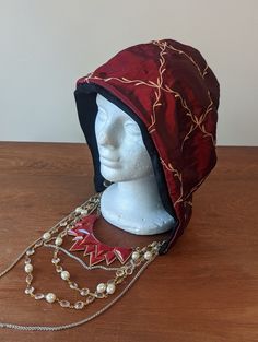 Fashion hood with antique jewelry. Made from vintage cotton material and hand made for a unique statement piece that no one else has. This piece has an antique locket to stash anything you may need for the night Antique Locket, Jan 11, San Luis Obispo, Ribbon Trim, Vintage Cotton, Red Floral, Locket, Antique Jewelry, Cotton Material