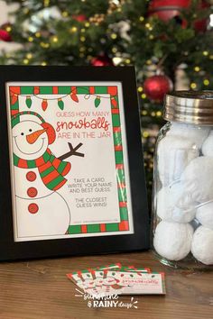 a jar filled with white cotton balls next to a christmas card and candy bar wrapper