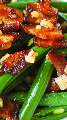 green beans, bacon and pine nuts are piled on top of each other