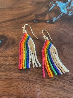 Hand made miyuki delica beaded earrings. Fun rainbow design and 14k gold fill fish hook wires. Rainbow Beaded Earrings, Delica Beaded Earrings, 100th Day Of School Crafts, Rainbow Fringe, Miyuki Bead, Miyuki Beads Pattern, Seed Bead Jewelry Patterns, Beads Pattern, Earrings Patterns