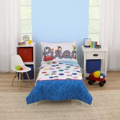 a child's bedroom with blue walls and furniture