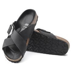 Siena Big Buckle Oiled Leather Black Double Strap Footbed Sandals With Leather Sole, Classic Black Double Strap Sandals, Black Double Strap Footbed Sandals With Tang Buckle, Classic Black Footbed Sandals With Buckle Closure, Black Leather Footbed Sandals With Tang Buckle, Classic Footbed Sandals With Tang Buckle And Round Toe, Classic Open Toe Footbed Sandals With Tang Buckle, Classic Leather Footbed Sandals With Adjustable Strap, Classic Double Strap Footbed Sandals With Buckle