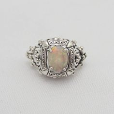 Vintage Sterling Silver White Opal Filigree Ring....Marked 925...Total of weights 2.5grams.... Size 7...Measure of Face 12.9MM...It's in very good condition. Formal Hallmarked Sterling Silver Opal Ring, Antique Sterling Silver Opal Ring For Anniversary, Silver Heirloom Opal Ring, Hallmarked, Heirloom Silver Hallmarked Opal Ring, Classic Silver Opal Ring Hallmarked, Classic Silver Hallmarked Opal Ring, Classic Hallmarked Silver Opal Ring, Classic Sterling Silver Hallmarked Opal Ring, White Gold Opal Ring Stamped 925 For Formal Occasions