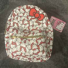 the hello kitty backpack is on display with its tag attached to it's side