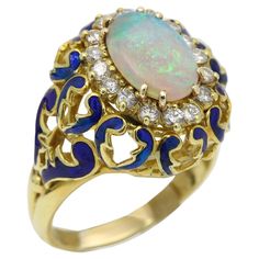 Vintage Opal Ring with Diamonds and Enamel. the finger size currently is 11.5 (it is possible to resize however I rather not take the risk incase the enamel gets damaged. overall very brilliant and nice. it is pre-owned but in very good condition ! 18k Yellow Gold 16.5 grams Oval Opal from Australia size 13 x 9 Diamonds approx 0.75 carat nice white G-H-SI Blue Enamel as you can see in the filigree design. Unique and Beautiful Ring +Gift Box and Appraisal Vintage Opal Ring, Iris Ring, Tahitian Pearl Ring, Pearl Rings Vintage, Opal Ring Vintage, Take The Risk, Buckle Ring, Pearl And Diamond Ring, Vintage Style Rings