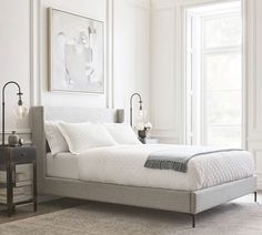 a bedroom with white walls and carpeted flooring