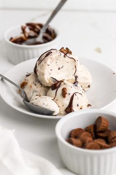 two white bowls filled with ice cream and nuts