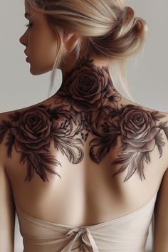 the back of a woman's neck with roses on it