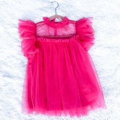 Need A Pink Me Up? This Fuchsia Top Has Lots Going For It: -Mesh Ruffled Flutter Sleeves -High Ruffled Neckline -Keyhole With Button Closure On Back -Lined Color: Fuchsia Model Is Wearing A Size Small:Height: 5'2'' Bust: 32in Waist: 26in Hips: 38in Pink Sheer Mesh Top For Party, Sheer Pink Mesh Top For Party, Pink Mesh Top For Spring, Pink Sheer Stretch Mesh Top, Spring Pink Mesh Top, Pink Stretch Mesh Top, Pink Mesh Top For Summer Party, Feminine Mesh Top For Spring Party, Feminine Spring Mesh Top For Parties