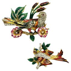 2 Coro Craft brooches, Birds on branch, gold plated Sterling , enamailing, rhinestones, 1942 USA 1 large bird on branch with Bullrusher and flowers and one smaller bird on branch, also gold plated sterling, enamailing and rhinestons, also Coro Craft 1942 USA Dimensions, the larger Coro bird brooch 5,5 cm x 5 cm x 1,2 cm the little Coro bird brooch 4,5 cm x 3 cm x 0,5 cm Fuatures: - Both brooches (mother and child) are gold plated sterling, with a beautiful enamel finish and set with small rhinestones. - Signed with Coro Craft Sterling - Designer Adolf Katz in the 1940's USA -Excellent Condition Antique Multicolor Brooches As Gifts, Multicolor Bird Design Jewelry, Luxury Vintage Hallmarked Brooches, Coro Jewelry Vintage, Birds On Branch, Valentino Couture, Bird On Branch, Bird Brooch, Vintage Purses