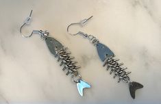 These silver fish earrings move just like real fish would swim and are extremely unique! Get your pair today! Real Fish, Fish Earrings, Silver Fish, Dope Jewelry, Velvet Bag, Jewelry Earrings Dangle, Really Cool Stuff, Etsy Earrings, Jade