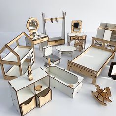 an assortment of wooden furniture and mirrors on white table top with tabletop in the middle