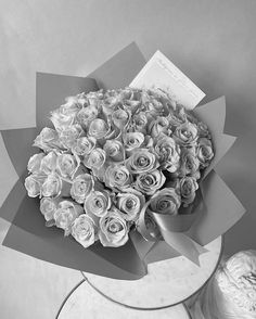 a bouquet of roses sitting on top of a table