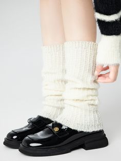 Embrace the chill of autumn and winter with these delightful leg warmers, available in classic shades of white, black, and gray. Crafted from a soft, cozy knit, these leg warmers are designed to keep you warm and stylish all season long. Solid Color Knee-high Socks For Winter, Cream Knee-high Socks For Fall, Gray Mid-calf Socks For Fall, Warm Beige Winter Socks, Casual Acrylic Winter Socks, Warm Beige Socks For Winter, Black Socks For Fall, Soft Trendy Socks For Fall, Soft Cream Socks For Fall