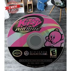 a video game disc sitting on top of a carpet next to a chair and table