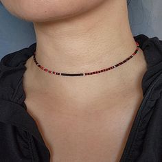 Unique choker necklace made with matte black, matte red Miyuki beads and 925 sterling silver beads. 925 sterling silver lobster claw clasp. This necklace is safe to wear in water.  See more seed bead necklaces at my store:  https://www.etsy.com/shop/FayFayJewelry?ref=dashboard-header&section_id=50377409 Visit my store for more unique handmade jewelry pieces: https://fayfayjewelry.etsy.com All jewelry pieces in this store are designed and handmade by myself. Please don't hesitate to reach out if you have any questions or requests! Minimalist Red Beaded Necklaces, Minimalist Red Beaded Necklace, Red Minimalist Beaded Necklace With Tiny Beads, Minimalist Red Beaded Necklace With Tiny Beads, Red Minimalist Beaded Necklace, Minimalist Black Beads For Gifts, Minimalist Black Beads For Gift, Minimalist Black Beads As Gift, Minimalist Black Beaded Necklaces As Gift