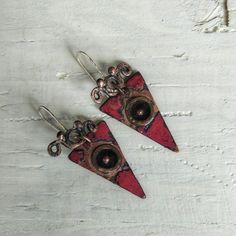 These exquisite earrings are a blend of modern and vintage aesthetics, hence the name "Now and Then." The bold triangle shape adds a contemporary touch, while the red enamel brings a vibrant pop of color. The black enamel circle with the copper dot represents a timeless focal point, symbolizing the connection between past and present Unique Triangle Earrings As A Gift, Unique Handmade Triangle Earrings, Vintage Aesthetics, Past And Present, Now And Then, Modern Earrings, Triangle Shape, Handmade Accessories, Black Enamel