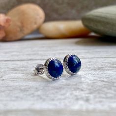 ★Metal- Sterling Silver★Stone- Genuine Lapis Lazuli★Size- 6mm diameter★Arrives ready for gifting and usually ships same day or next day. Check shop announcement for occasional delays.Lapis lazuli is a deep-blue stone which has been prized since antiquity for its intense color and has been one of the most sought after stones in use since man's history began. Its deep, celestial blue remains the symbol of royalty and honor, gods and power, spirit and vision. It is a universal symbol of wisdom and Blue Round Stone Earrings For Gift, Round Lapis Lazuli Gemstone Earrings, Blue Spiritual Earrings For Gifts, Round Lapis Lazuli Jewelry For Gifts, Blue Cabochon Gemstones For Gift, Adjustable Lapis Lazuli Earrings As Gift, Adjustable Lapis Lazuli Earrings For Gift, Minimalist Round Lapis Lazuli Jewelry, Raw Stone Earring