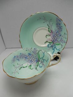 two porcelain dishes with flowers painted on them