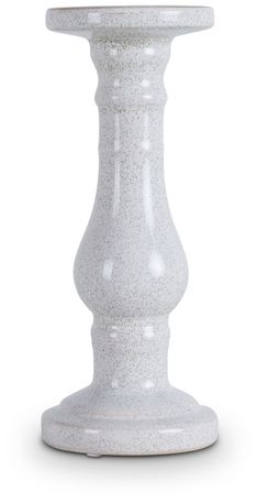 a white vase sitting on top of a table