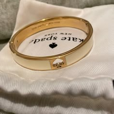 Kate Spade Bangle Bracelet. Cream And Gold. Kate Spade Gold Bangle, Kate Spade Bracelet Stack, Kate Spade Bangle Bracelet, Kate Spade Formal Bracelet Jewelry, Kate Spade Formal Bracelet, Formal Kate Spade Bracelet, Kate Spade Bangle Bracelet For Formal Occasions, Kate Spade Formal Bangle Bracelets, Kate Spade Formal Bangle Bracelet