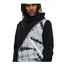 True Religion Men's Black Tie Dye Colorblock Hoodie Get Wavy In The Tie Dye Colorblock Hoodie. This Cotton Blend Pullover Hooded Sweatshirt For Men Features A Cool Color Block Design With Trippy Two-Tone Tie Dye. Finished With Two Front Slant Pockets, Logo Detailed Trim, And Banding At The Sleeves And Hem. The Perfect Match For The Logo Trim Track Pant.. Color: Black Regular Fit Pullover Hoodie Long Sleeve 66% Cotton, 34% Polyester Machine Washable Imported Casual Black Color Block Hoodie, Urban Sweatshirt With Patchwork For Streetwear, Urban Patchwork Sweatshirt For Streetwear, Black Hooded Color Block Top, Black Hooded Patchwork Top, Black Color Block Hooded Top, Black Hooded Top With Patchwork, Black Patchwork Hoodie Top, Casual Black Patchwork Sweatshirt