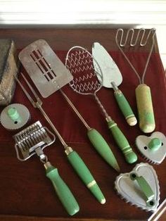 various kitchen utensils are arranged on a table