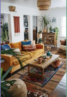 a living room filled with furniture and plants