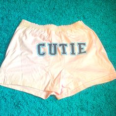 Brand New Pink Shorts With Cutie On The Back Shorts With Words On Back, Cute Loungewear Shorts For Spring, Cute Spring Pajama Shorts, Cute Stretch Bottoms Of Short Length, Summer Pajama Shorts With Letter Print, Summer Cotton Bottoms With Letter Print, Cute Bottoms With Elastic Waistband, Trendy Summer Bottoms With Letter Print, Summer Letter Print Pajama Shorts