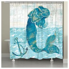 a shower curtain with an image of a mermaid and anchor